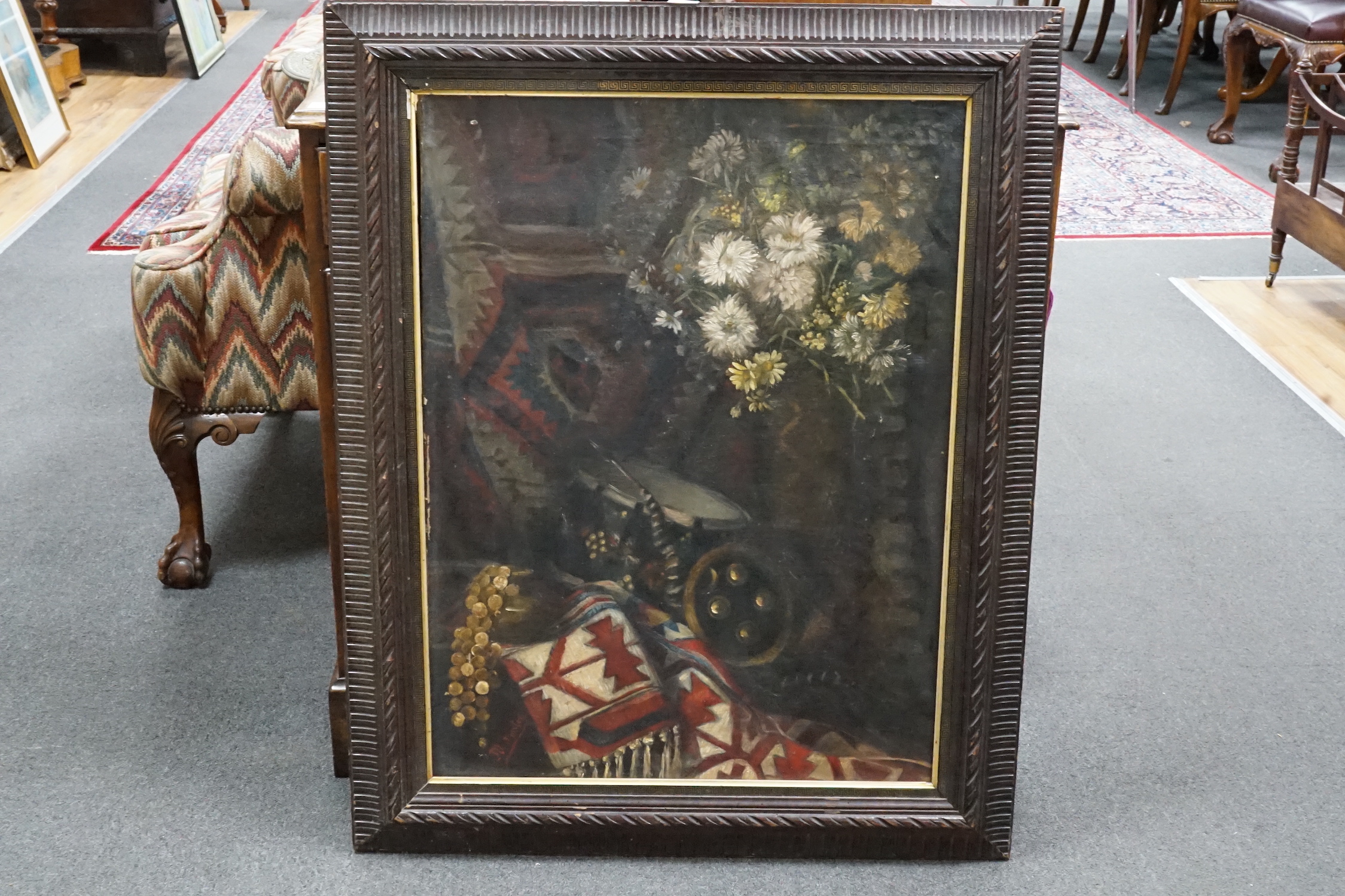 M. Koster c.1900, oil on canvas, Still life of North African artefacts and flowers, signed, 75 x 56cm